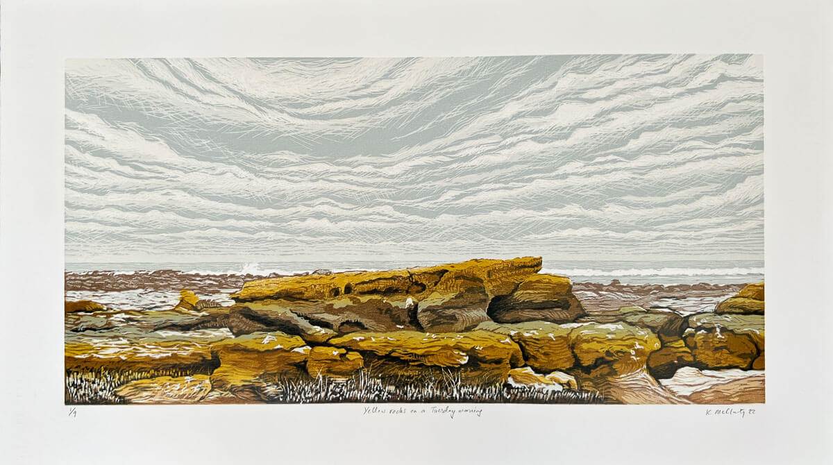 Woodblock print of a landscape showing yellow rocks in the foreground